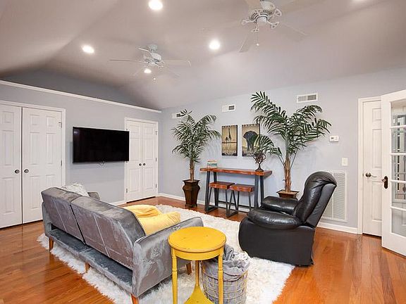 upstairs entertainment area with murphy bed and adjacent to dedicated work space