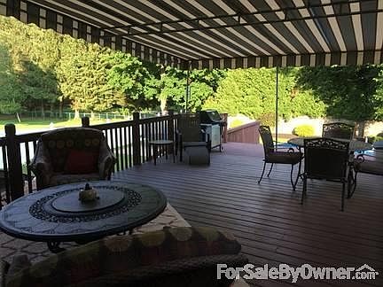 Custom Awning over rear deck.
						:
						Custom Awning over large deck leading to heated pool