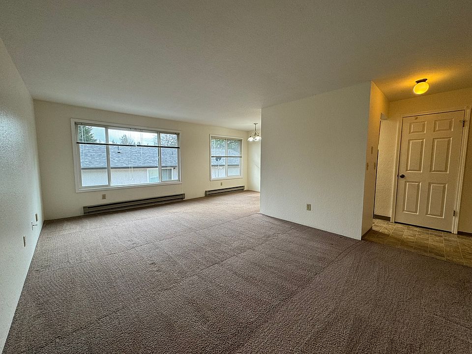 Spacious living area with large South facing double pane windows