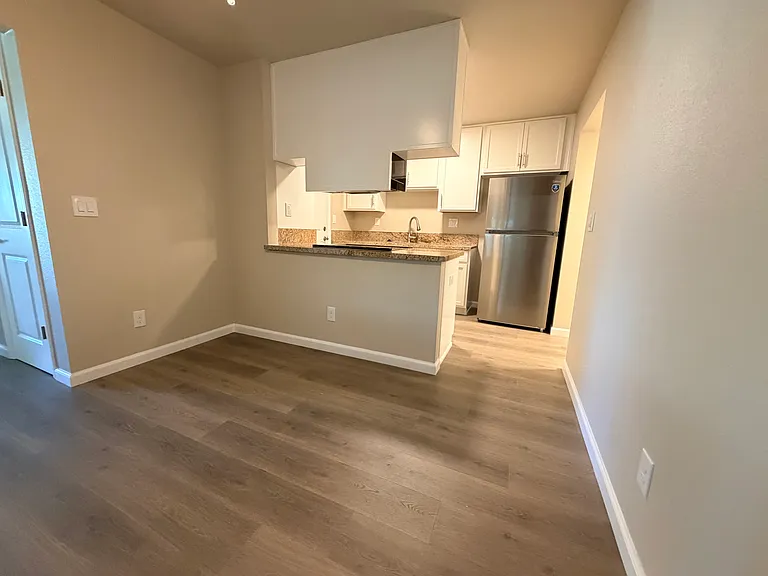 Dining area looking into kitchen.