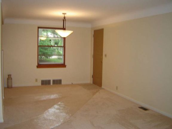 br /The Living Room easily flows into the Dining Room.br /(Notice the attractive new light fixture.)