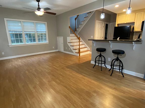 Downstairs living/dining area and kitchen with bar