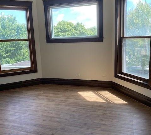 Large bedroom with tall ceilings, lots of light and large closet