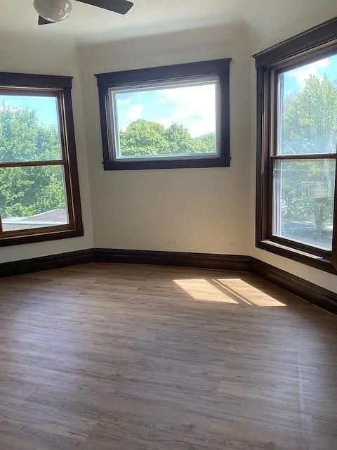 Large bedroom with tall ceilings, lots of light and large closet