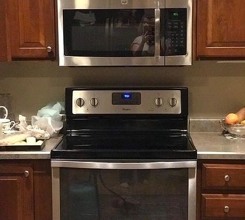 Cabinets are maple color.