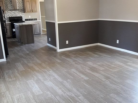 Separate living room w a ceiling fan