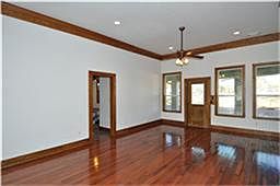 Den area with hardwood floors; connects to dining room