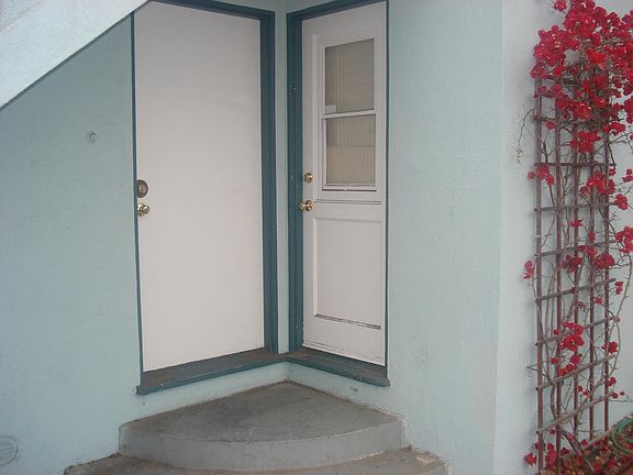 Doors leading into kitchen and living room.
