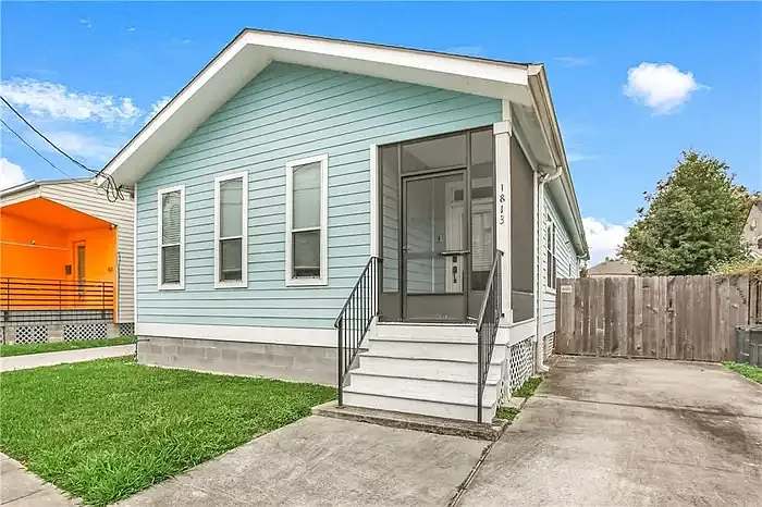 Front of the house with carport on the right.