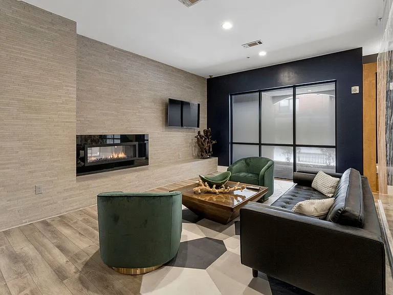 Relax in our cozy clubhouse with a fireplace and six flat-screen TVs for ultimate comfort and entertainment.