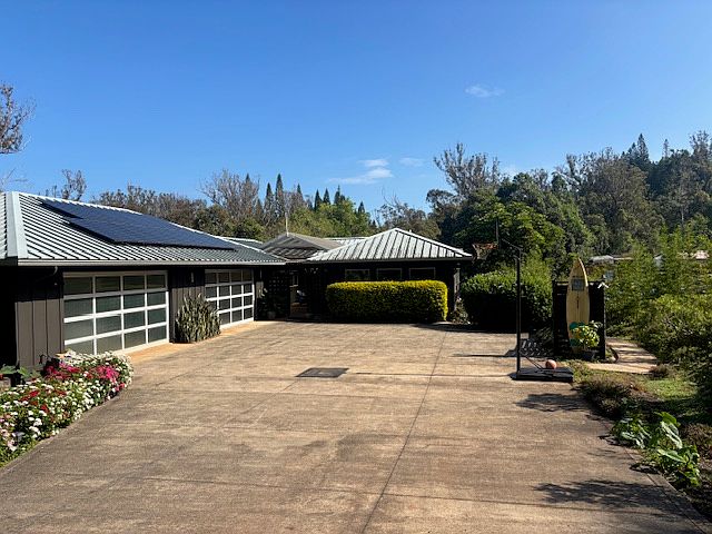 Front of house with 4 car garage. Two car side available