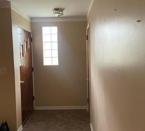 Front entryway with coat closet.