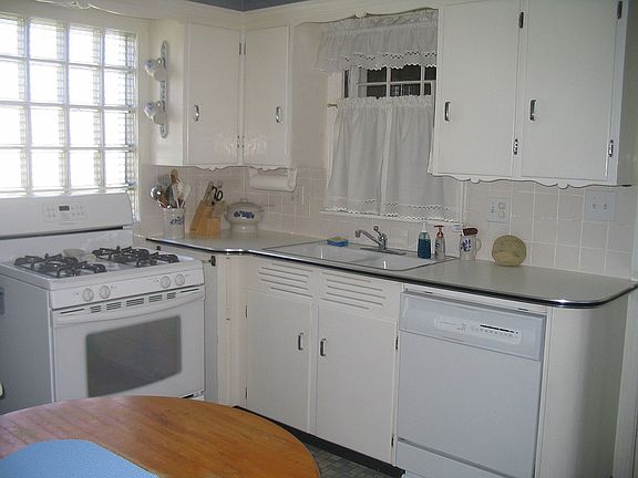 Kitchen with new gas range, built-in DW, ceramic tile