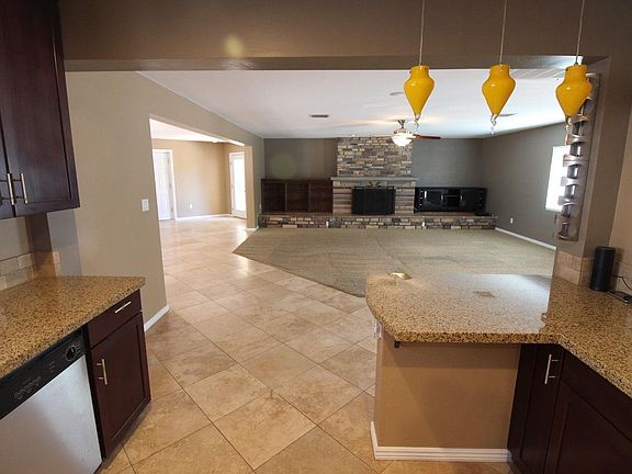 view from kitchen of Family Room and fireplace