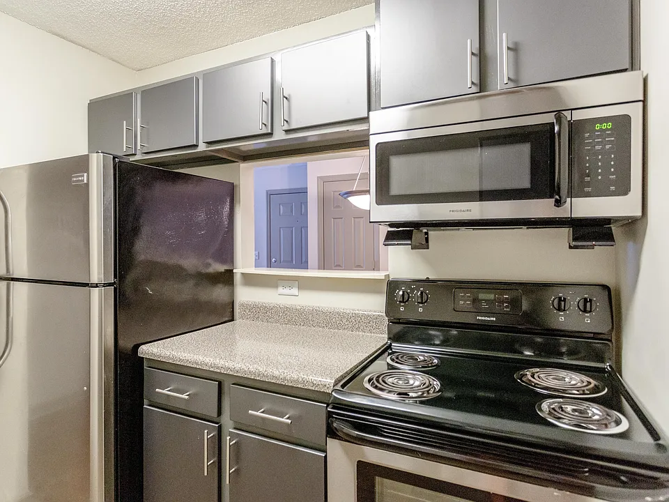 Kitchen with stainless appliances and modern cabinetry