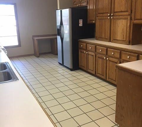 CABINETS in kitchen, nice fridge, and see the desk?