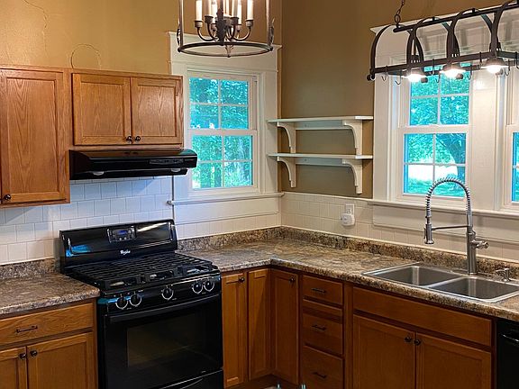 Quality Schrock cabinets; new Kohler commercial spray faucet fixture, custom crafted shelving