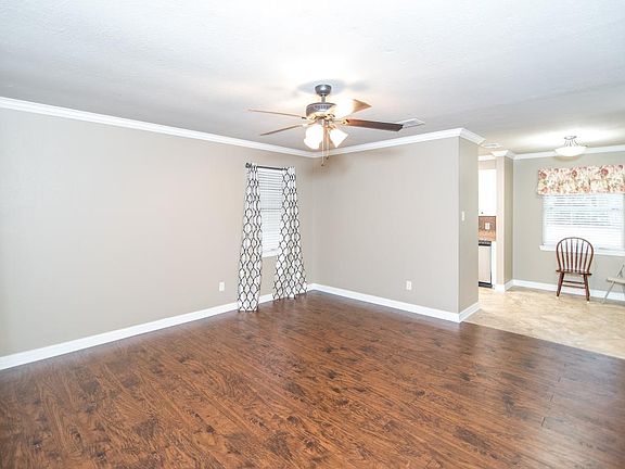 Living room from front door entrance. Leads in to kitchen's dining area.