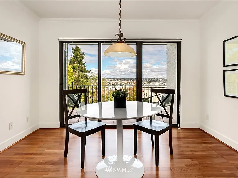 Secondary living/dining space leading out to balcony