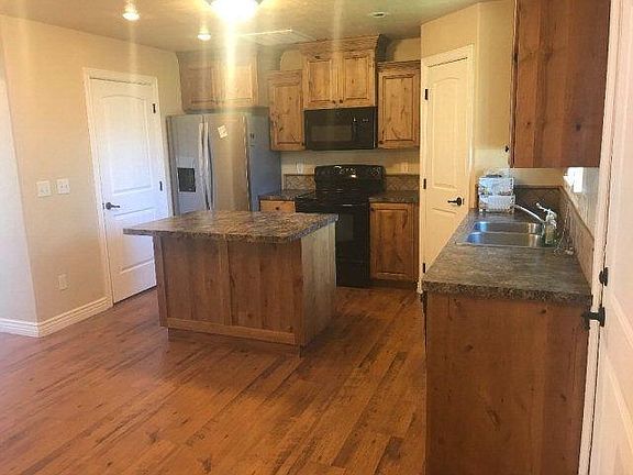 large kitchen with island and pantry. All appliances.