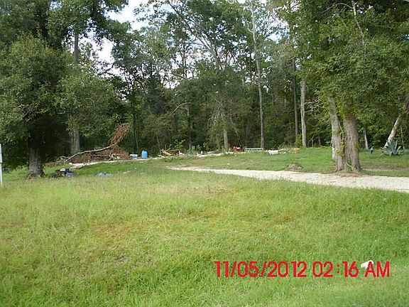 Needs some clean up but has lots of nice trees and flowering plants.