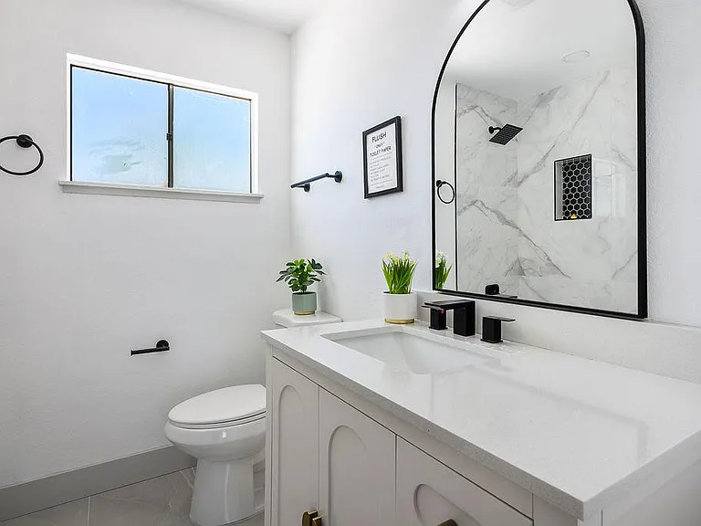 Quartz countertop, elongated toilet