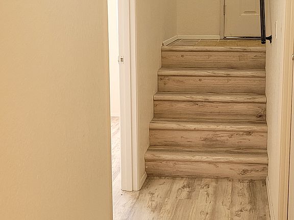 Lower level stairs to landing