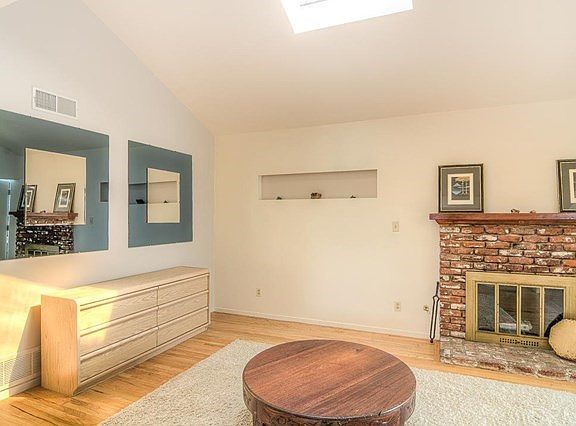 BRICK FIREPLACE AND SKYLIGHTS