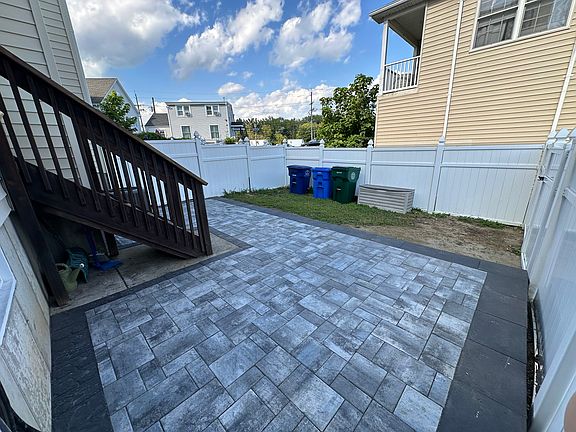 New patio perfect for a round table with umbrella and chairs