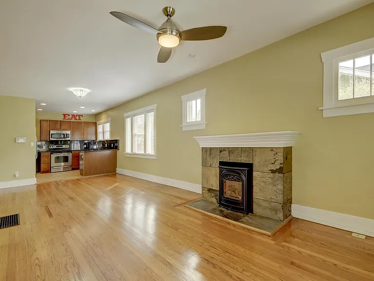 Open concept living, dining and kitchen areas. Energy efficient gas fireplace