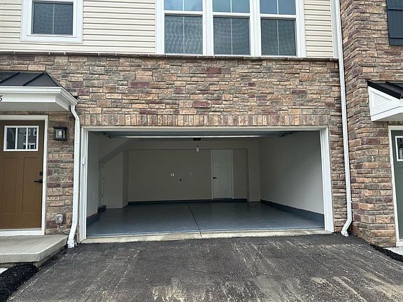 Two Car Garage - Finished, Epoxy Coated, Electric Car plug in, access to office room