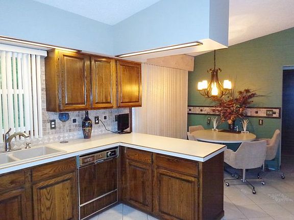 Informal dining area in the kitchen. Ceramic tile flooring.