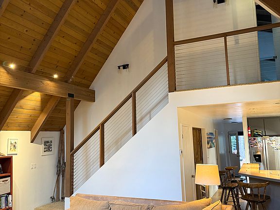living area and stairs to master