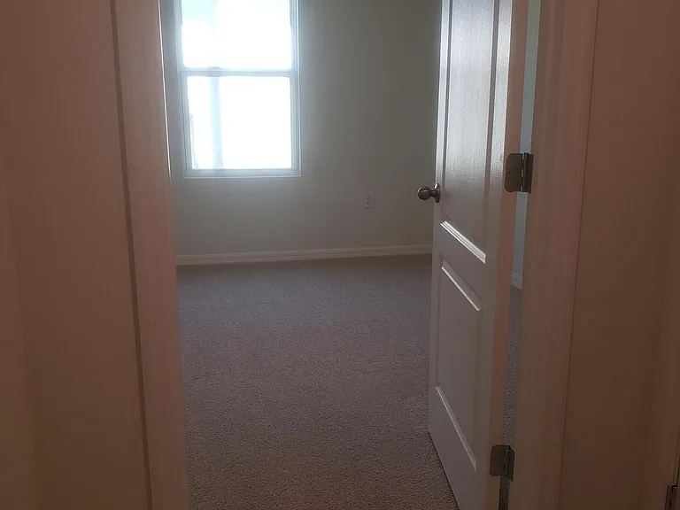 2nd bedroom, off main hallway. Blinds on all windows ceiling fan included in all bedrooms.