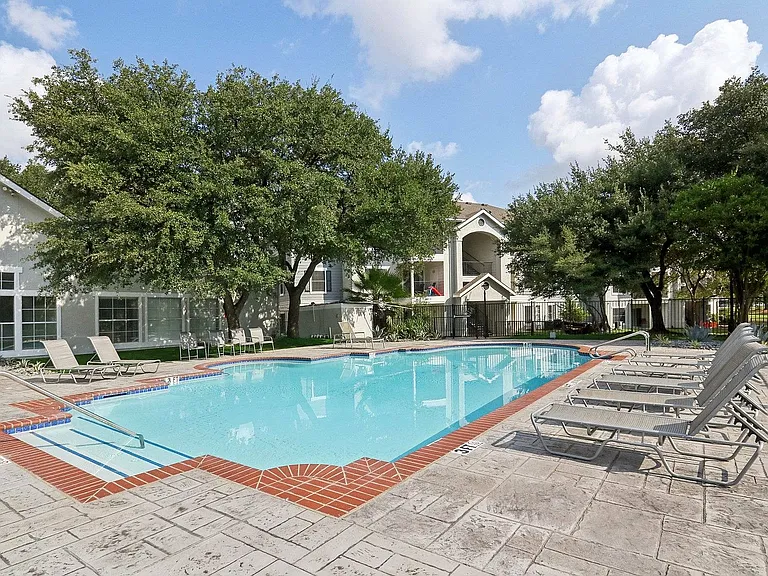 Enjoy warm Texas days at Avonmora's sparkling pool, designed for both relaxation and community connection.