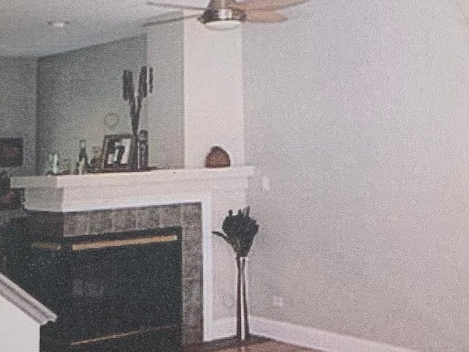 Living room w/fireplace & sun room other side of fireplace open area w/hardwood floors!