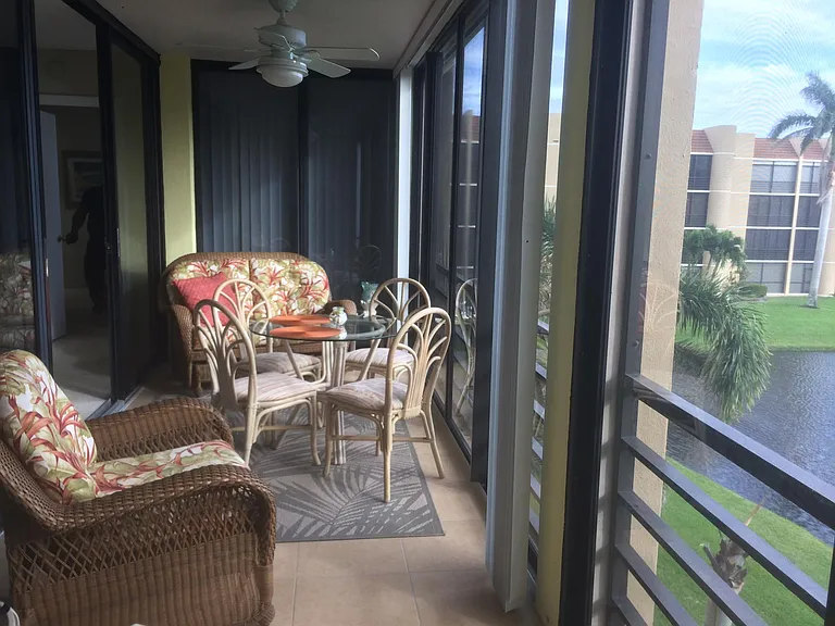 Balcony with a dining area_a perfect spot to relax, breathe in the fresh Florida air, and enjoy the view of the water!