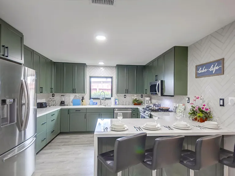 Share meals or set up a makeshift workspace in the spacious kitchen island