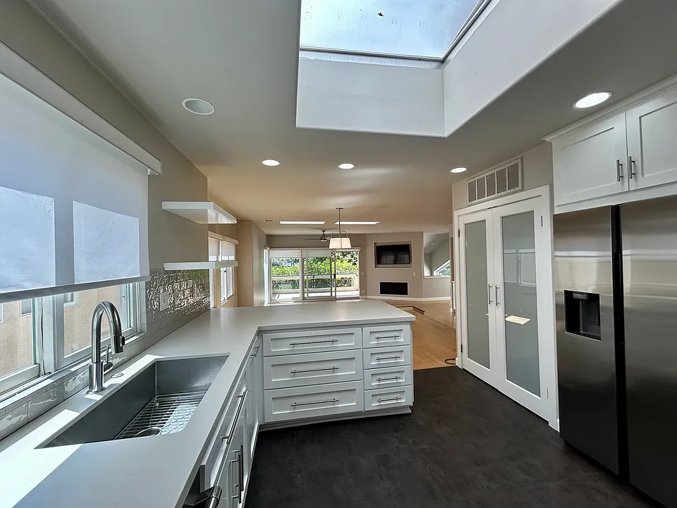 Light and bright kitchen open to living room