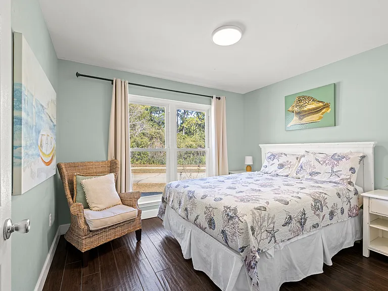 Bedroom 3 is bright and inviting, with comfortable bedding, modern furnishings, and plenty of closet space.