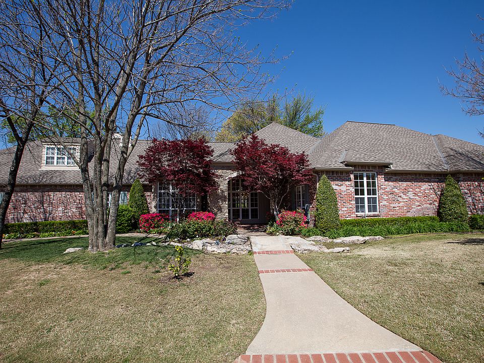 Stunning one-owner, beautifully light & bright, mostly one-level in gated Jenks East!