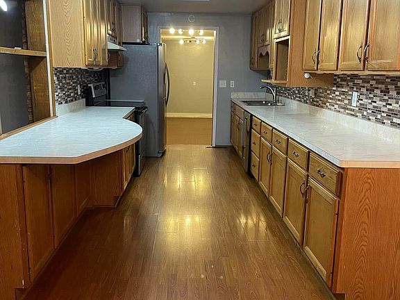 *UPDATED PICTURES COMING* New Vinyl Plank Flooring, New Dishwasher, and New Stove.

Kitchen - Step Down Into Oversized Laundry Room also updated floors.