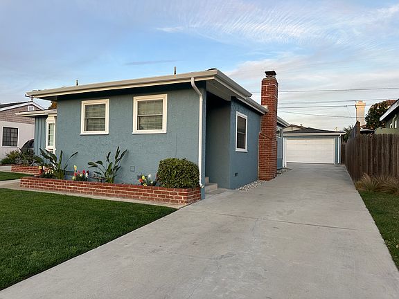 Long Driveway leads to detached Two- Car Garage