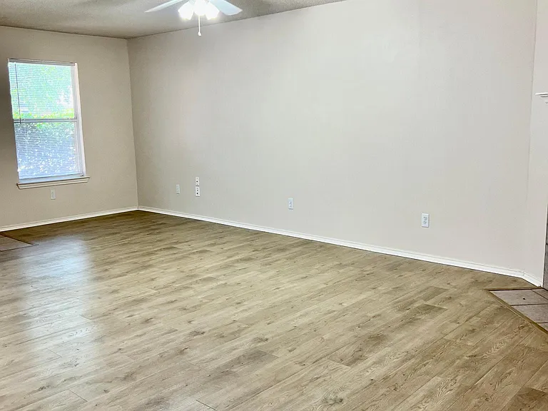 Open concept Living/Dining room with light, new luxury vinyl plank wood-like flooring. Both functional and stylish.