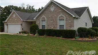 Shrubbery surrounds house