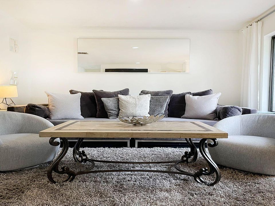 Living room with 70-inch smart TV with cable TV.