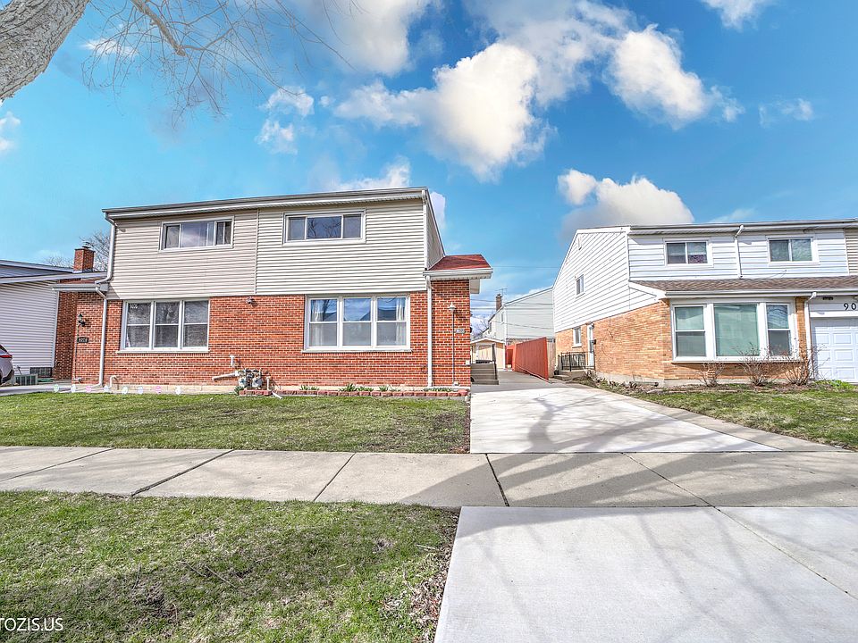 Front Elevation with Long Concrete Drive Way