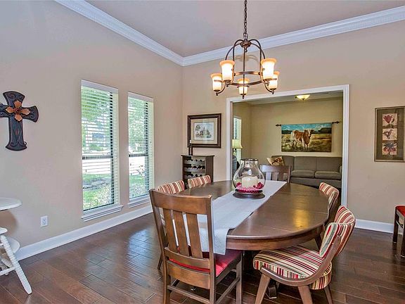Hand scraped wood flooring extends throughout this home.