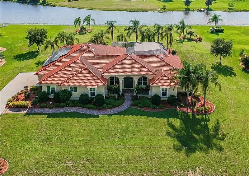 Luxurious Grand Toscana nestled within this RiverRanch Preserve 3,734 s.f. Living area and 1.12+ acre
