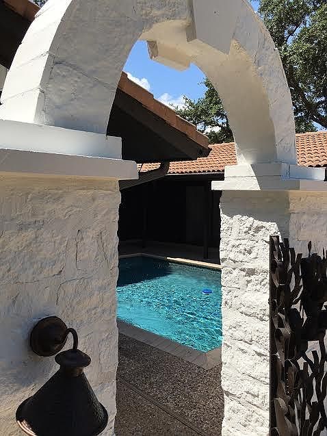 Elegant entry with pool and courtyard